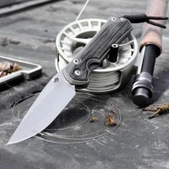 CHRIS REEVE KNIVES Chris Reeves Small Sebenza 31 Black Canvas Micarta 18 CHRIS REEVE KNIVES Chris Reeves Small Sebenza 31 Black Canvas Micarta