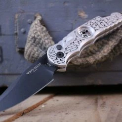 PROTECH KNIVES All Knife Brands ProTech TR-5.62 Shaw Skull & Barbed Wire DLC (USA) 9 PROTECH KNIVES All Knife Brands ProTech TR-5.62 Shaw Skull & Barbed Wire DLC (USA)